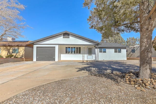 ranch-style home with a garage