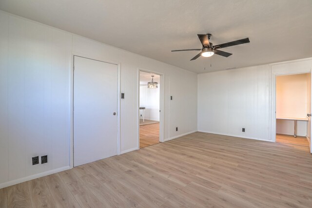 unfurnished bedroom featuring ceiling fan and light hardwood / wood-style flooring