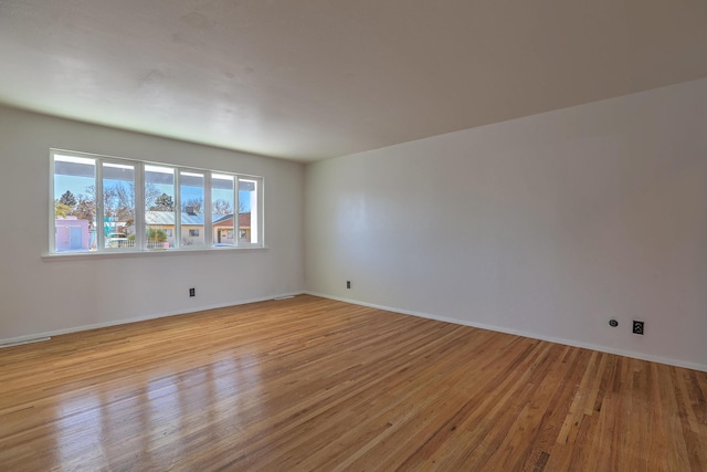 spare room featuring light hardwood / wood-style flooring