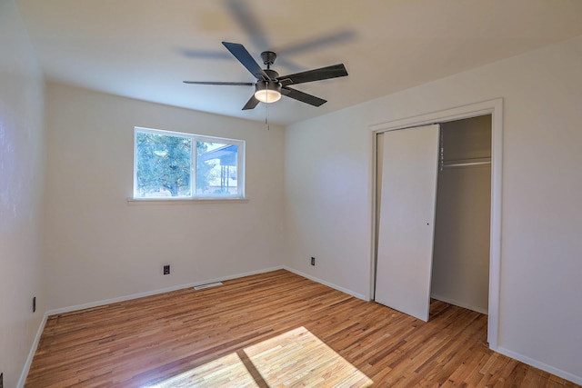 unfurnished bedroom featuring a closet, ceiling fan, and light hardwood / wood-style floors