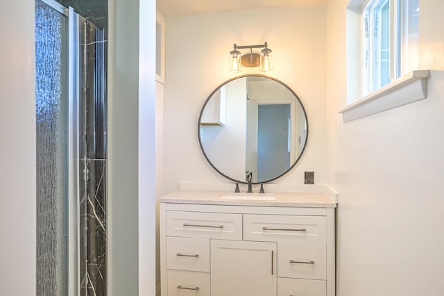 bathroom featuring vanity and a shower