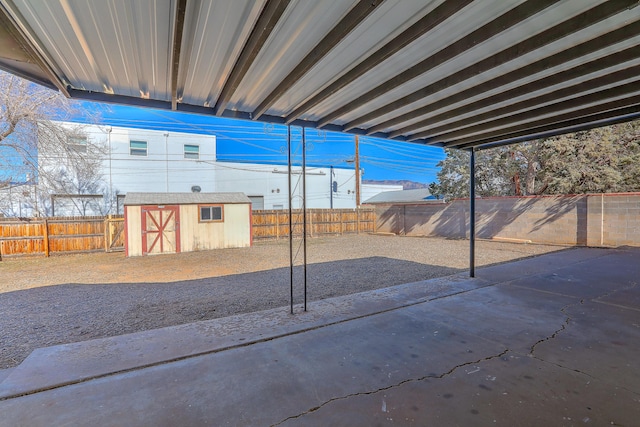 view of patio featuring a storage unit