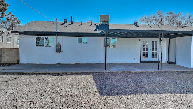 rear view of property featuring french doors and a patio