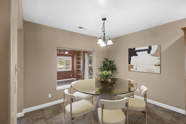 dining area with a chandelier