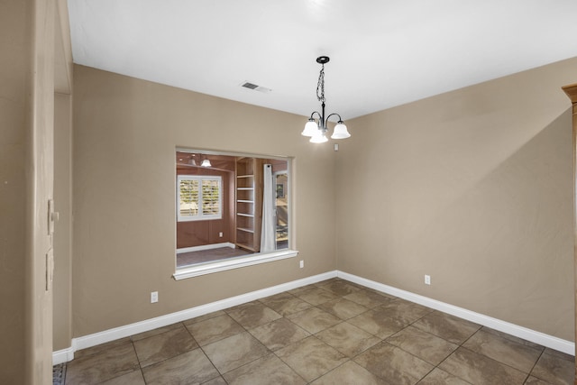 unfurnished dining area featuring a notable chandelier