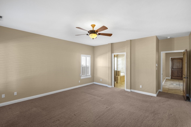 empty room with light carpet and ceiling fan