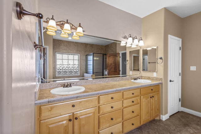 bathroom with tile patterned floors, vanity, and an enclosed shower