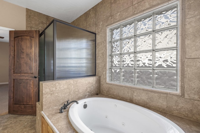 bathroom with tile patterned floors and separate shower and tub