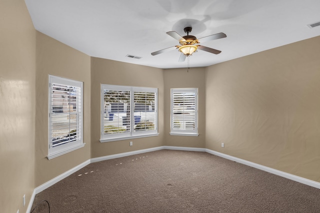 unfurnished room featuring ceiling fan and carpet floors