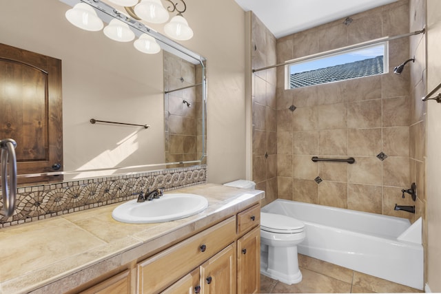 full bathroom with vanity, toilet, tiled shower / bath combo, and tile patterned flooring