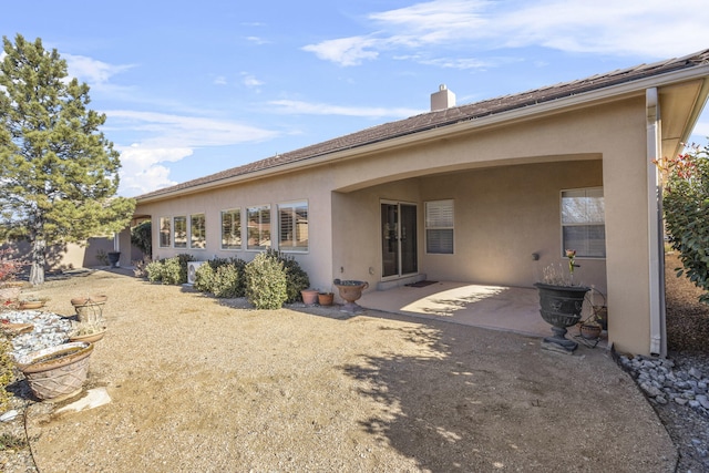 back of house with a patio area