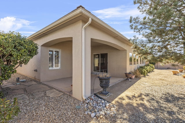 back of property featuring a patio