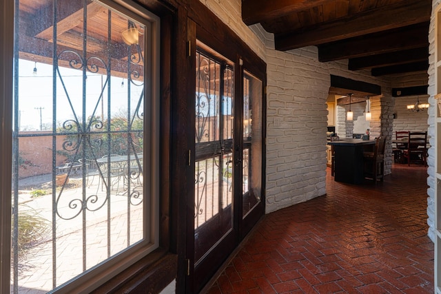 interior space featuring wooden ceiling and beamed ceiling