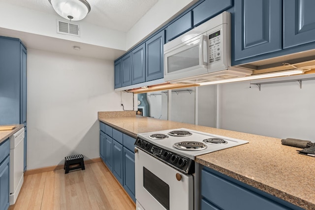 kitchen with blue cabinets, a textured ceiling, white appliances, and light hardwood / wood-style flooring