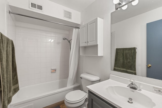 full bathroom featuring vanity, shower / bath combination with curtain, and toilet