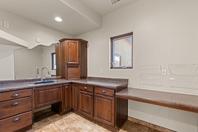 kitchen with sink and light tile patterned floors