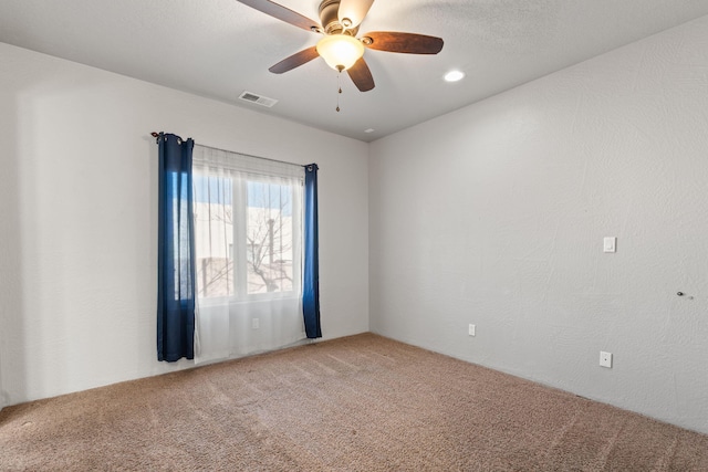 carpeted empty room with ceiling fan