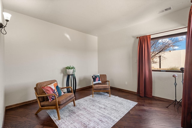 sitting room with dark hardwood / wood-style flooring