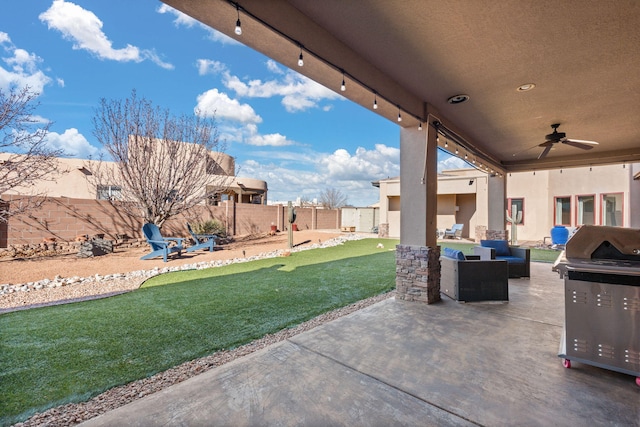 view of patio / terrace featuring a grill and ceiling fan