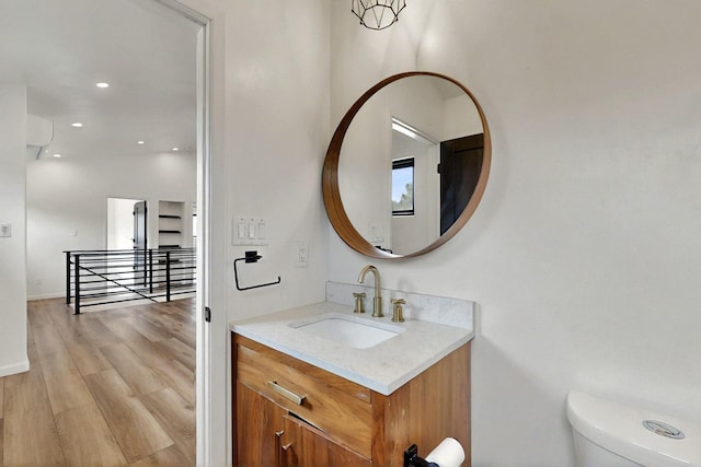450 Juan Tomas Rd, Tijeras, NM 87059 - bathroom with vanity, wood finished floors, and recessed lighting