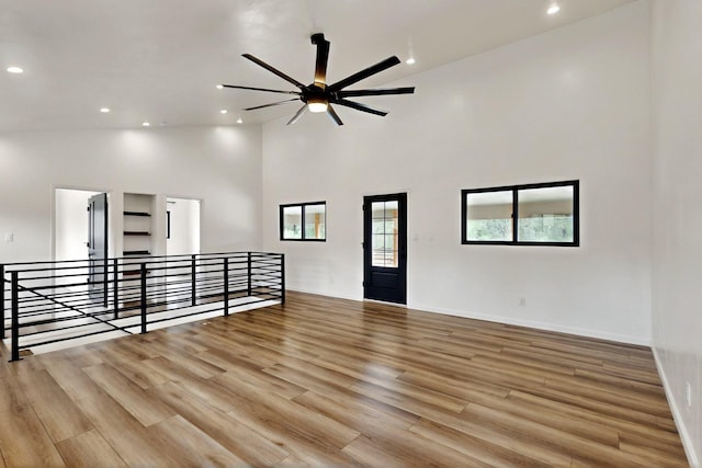 450 Juan Tomas Rd, Tijeras, NM 87059 - unfurnished room featuring ceiling fan, wood finished floors, high vaulted ceiling, and recessed lighting
