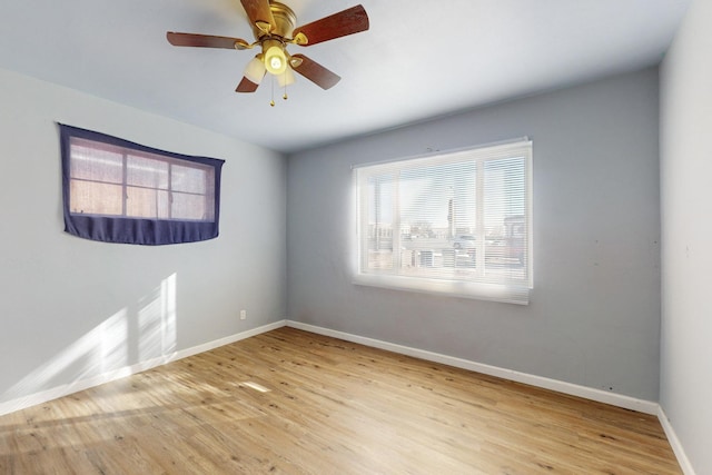 unfurnished room featuring light hardwood / wood-style floors and ceiling fan