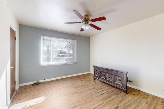 spare room with ceiling fan and light hardwood / wood-style floors