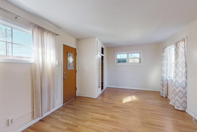 spare room with light wood-type flooring