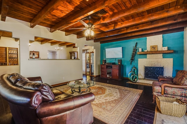 living room featuring ceiling fan, hardwood / wood-style floors, beam ceiling, a brick fireplace, and wooden ceiling