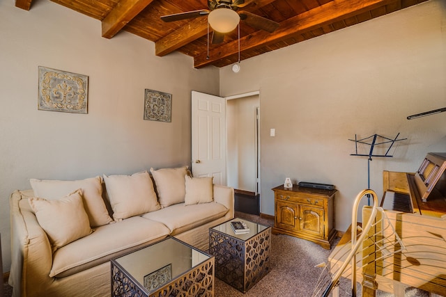 living room featuring beamed ceiling, ceiling fan, and wood ceiling