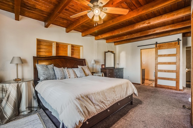 bedroom with beamed ceiling, a barn door, carpet floors, and wooden ceiling