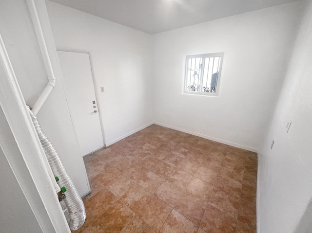 empty room with baseboards