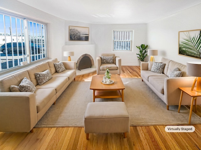 living area featuring plenty of natural light and light wood-type flooring