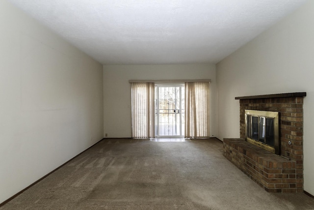 unfurnished living room with a fireplace and carpet flooring