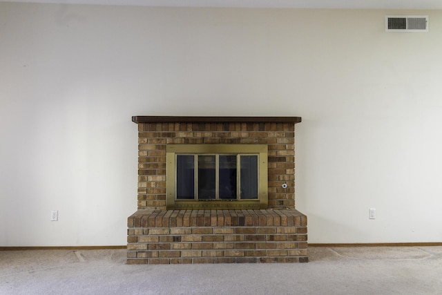 details featuring carpet flooring and a brick fireplace