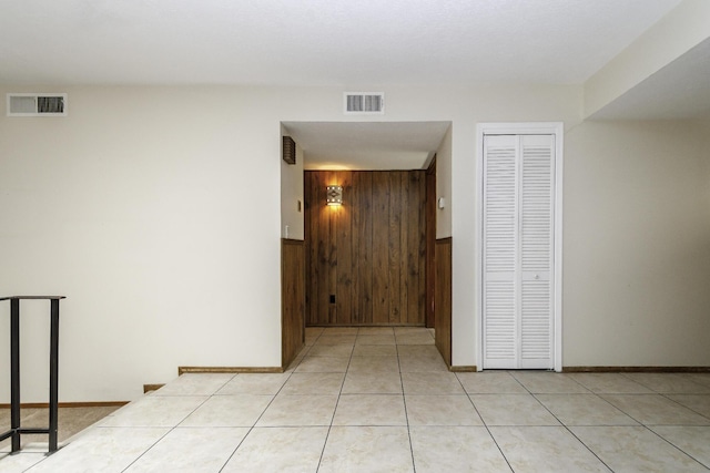 hall featuring wood walls