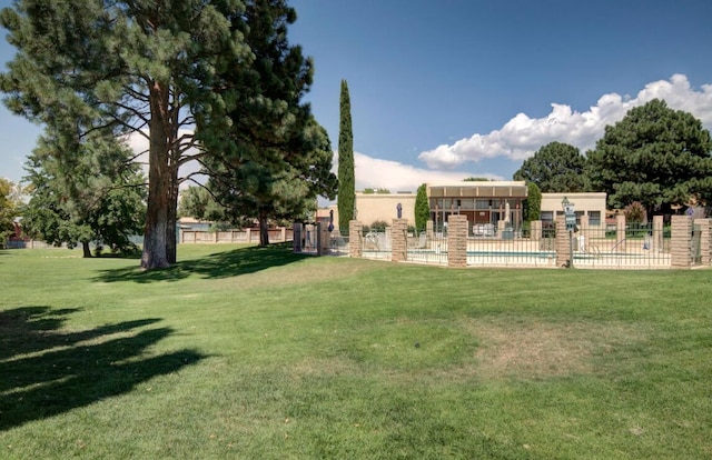 view of yard featuring a community pool