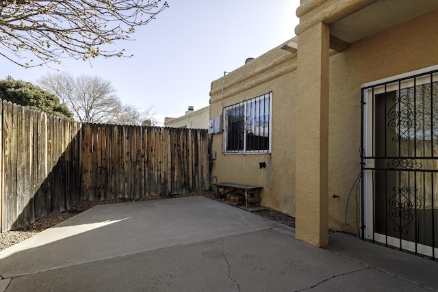 view of side of property with a patio area