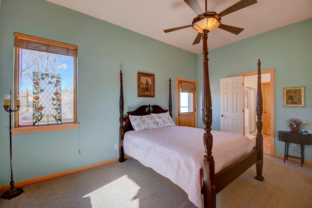 carpeted bedroom featuring multiple windows and ceiling fan