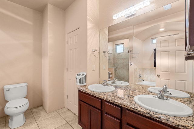 full bathroom featuring independent shower and bath, vanity, tile patterned floors, and toilet