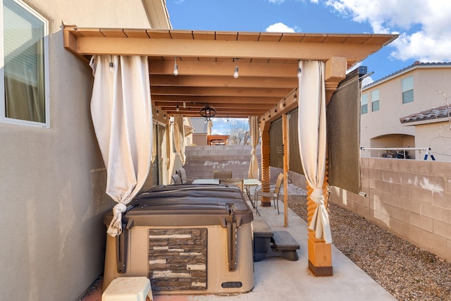 view of patio with a hot tub