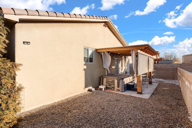 back of house with a patio