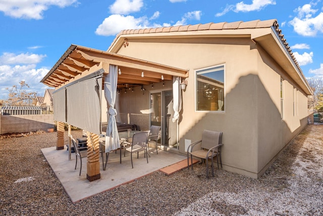 rear view of house with a patio