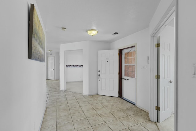 interior space featuring light tile patterned floors