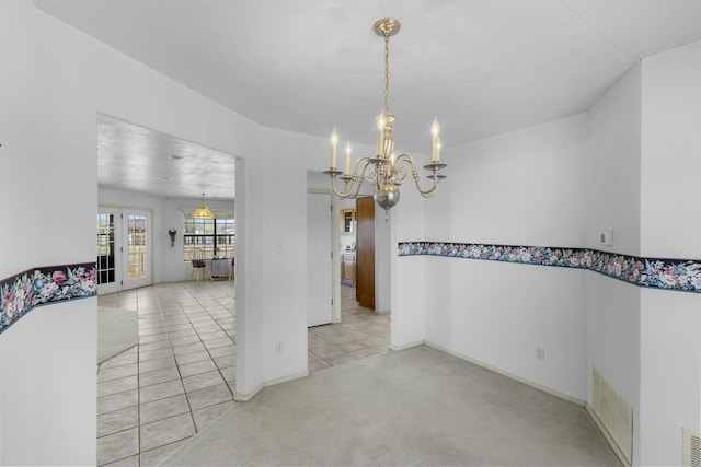 unfurnished dining area featuring light carpet and a chandelier