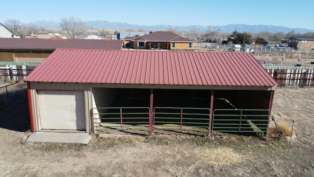 exterior space featuring a mountain view and an outbuilding