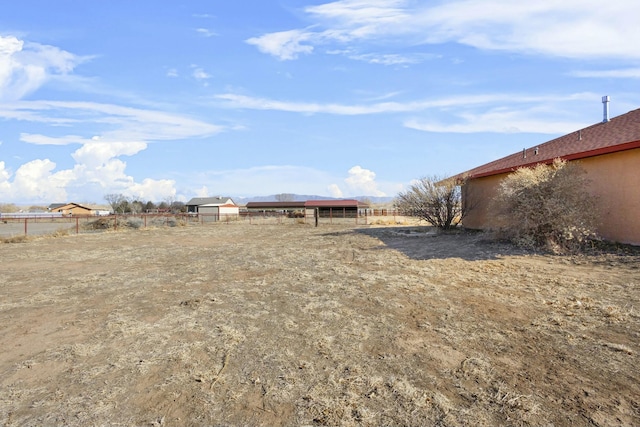 view of yard with a rural view