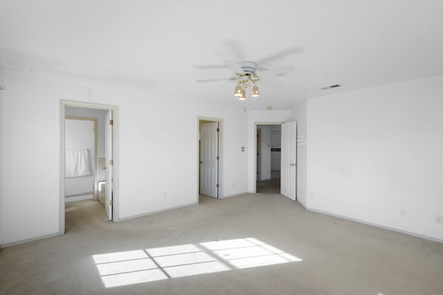 unfurnished bedroom with light colored carpet and ensuite bath