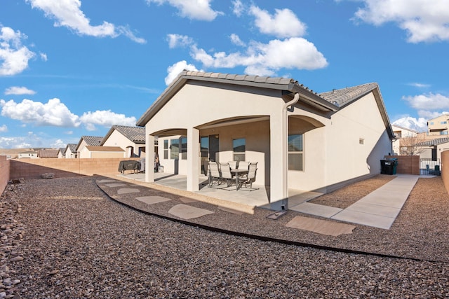 rear view of house with a patio area