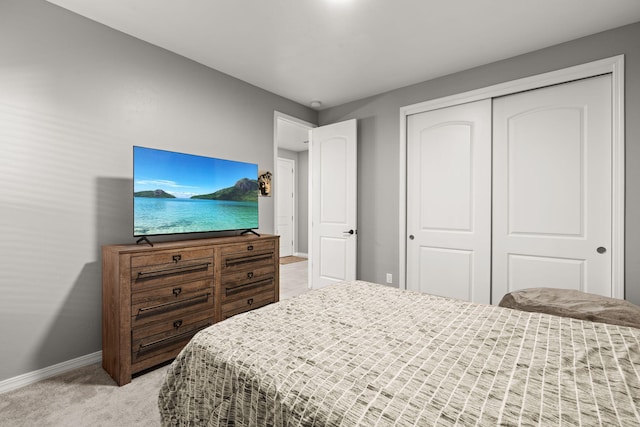 carpeted bedroom with a closet